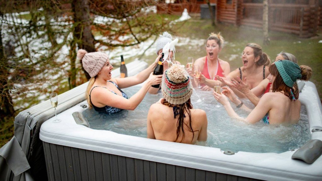 Female friends enjoying hot tub